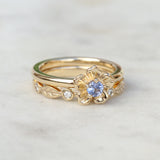 sapphire forget me not flower ring with a diamond leaf ring