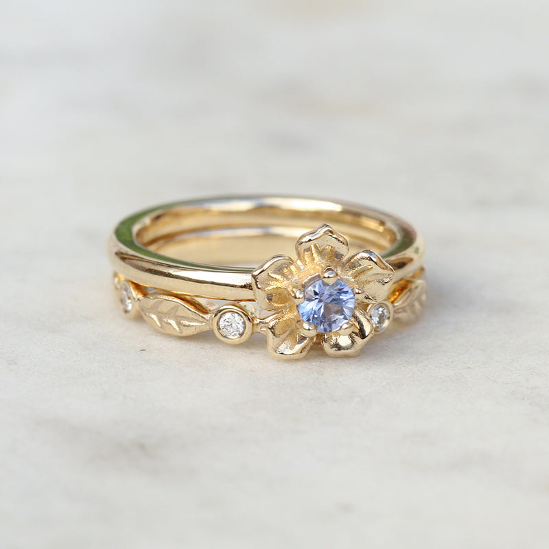 sapphire forget me not flower ring with a diamond leaf ring