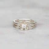 forget me not flower diamond engagement ring and leaf wedding band