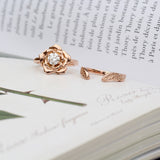 rose engagement ring and leaf wedding ring