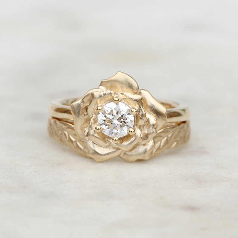 rose engagement ring and leaf wedding ring