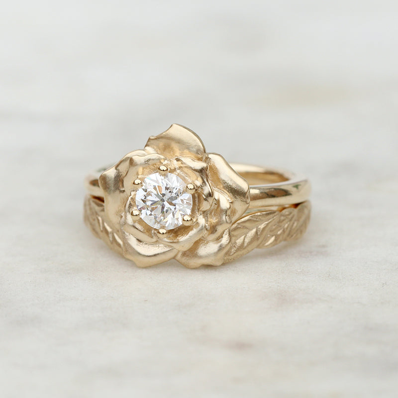 diamond rose engagement ring and leaf wedding ring
