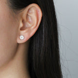 daisy stud earrings in gold and silver