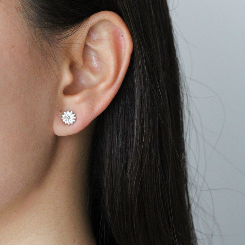 daisy stud earrings in gold and silver